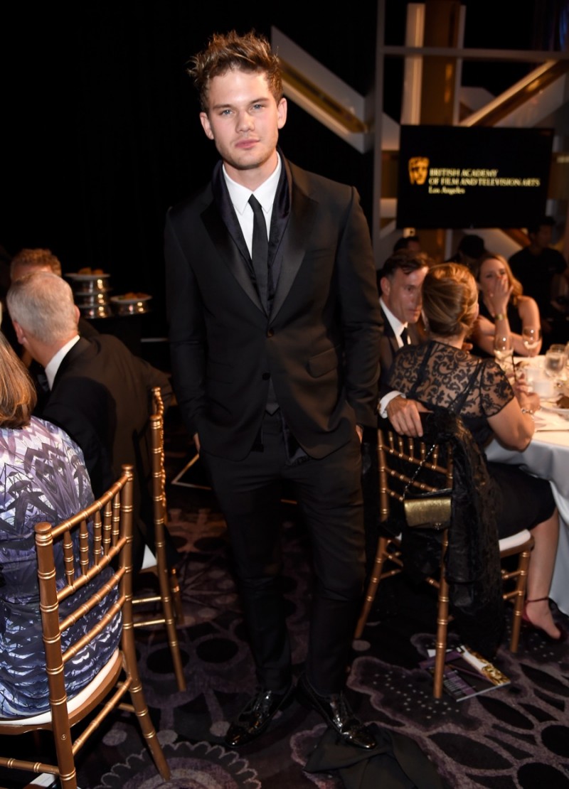 Wearing Burberry, actor Jeremy Irvine attends the BAFTA Los Angeles Jaguar Britannia Awards presented by BBC America and United Airlines at The Beverly Hilton Hotel on October 30, 2014 in Beverly Hills, California.