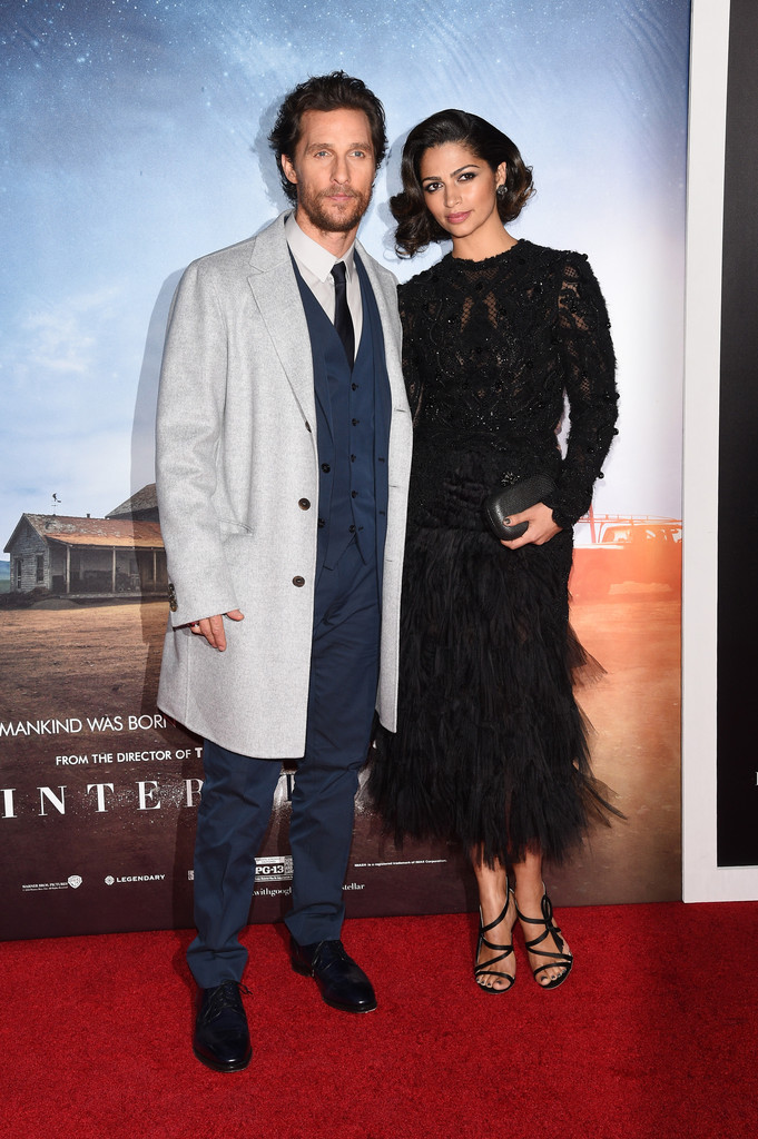 Attending the New York City premiere of 'Interstellar' on November 3rd, Matthew McConaughey once again hit the red carpet in a tailored look from Dolce & Gabbana. Posing alongside his wife Camila Alves, McConaughey dons a three-piece navy suit with a gray overcoat.