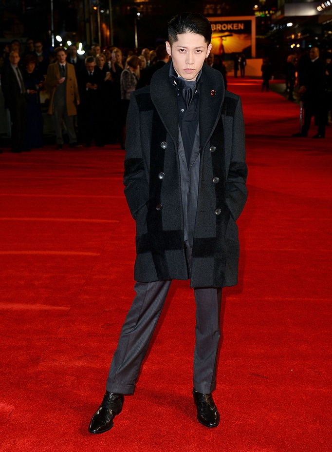 Attending the London premiere of 'Unbroken' on November 25th, actor and singer Miyavi turned heads. Hitting the red carpet in a phenomenal tailored look from Ermenegildo Zegna Couture, Miyavi layered in a graphic double-breasted coat with a versatile scarf, sharp, gray suit and smart polo shirt.