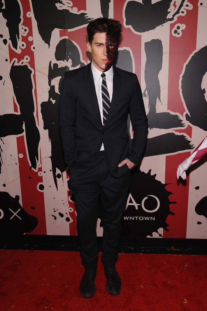 Nolan Gerard Funk is Batman villain Two-Face for Halloween, wearing a suit from New York-based designer Richard Chai.