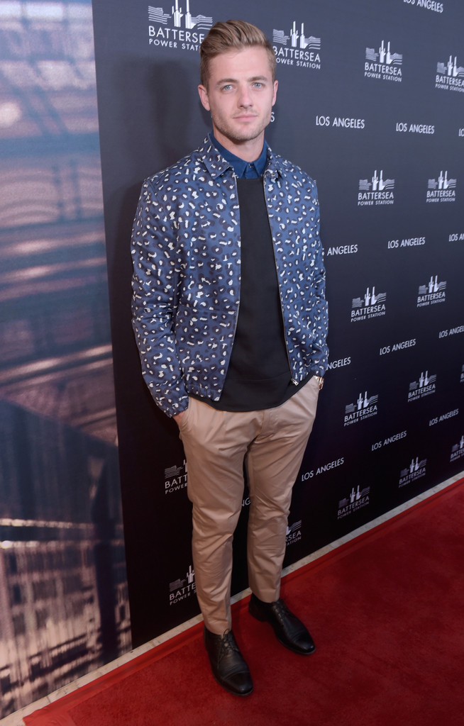 Attending the Battersea Power Station launch party on November 6th in West Hollywood, California, soccer player Robbie Rogers made a leopard statement in a jacket from French label A.P.C. Rogers paired his bold jacket with with a pair of khaki chinos and layered tops.