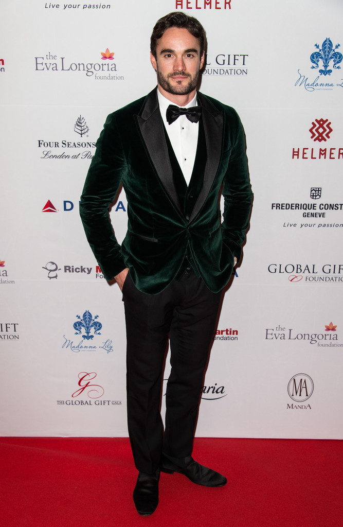 An elegant vision in a look from Italian label Dolce & Gabbana, Thom Evans attended the 5th Global Gift Gala hosted by actress Eva Longoria. Hitting the red carpet for the London event, Evans charmed in an evening look that was complete with a green velvet dinner jacket.