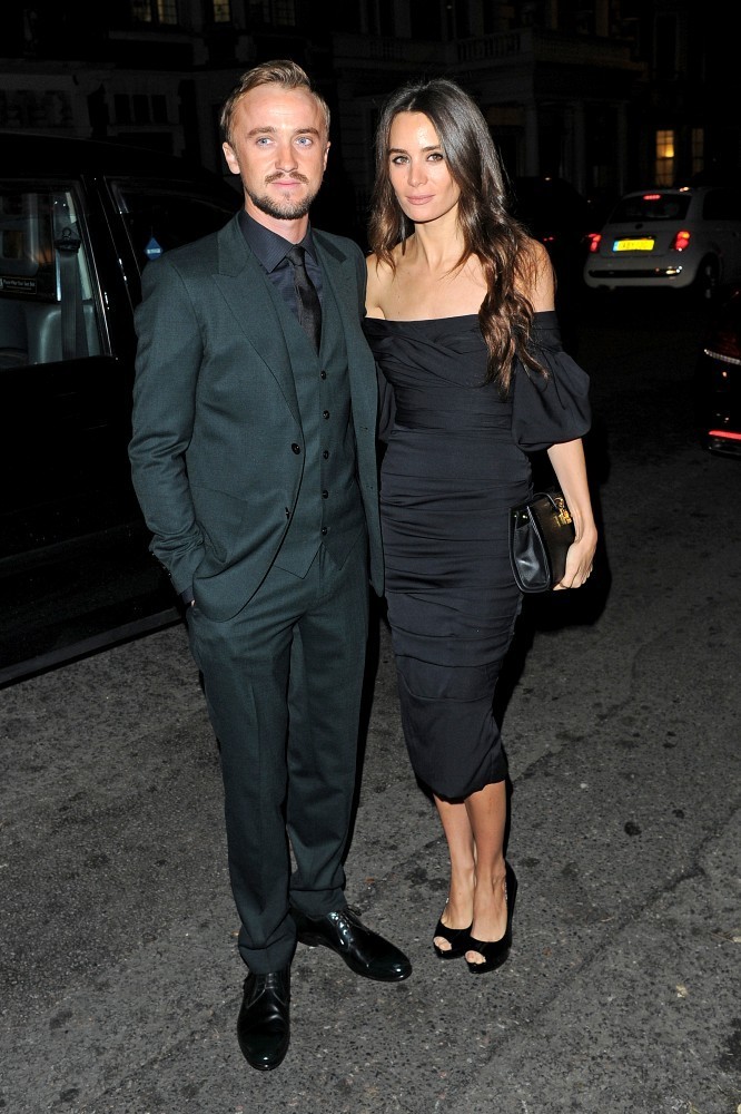 Joined by Jade Olivia, actor Tom Felton attended the unveiling of Claridge's Christmas Tree. For the festive occasion, Felton cleaned up in a three-piece, slim-cut, tailored suit from Italian label Dolce & Gabbana.