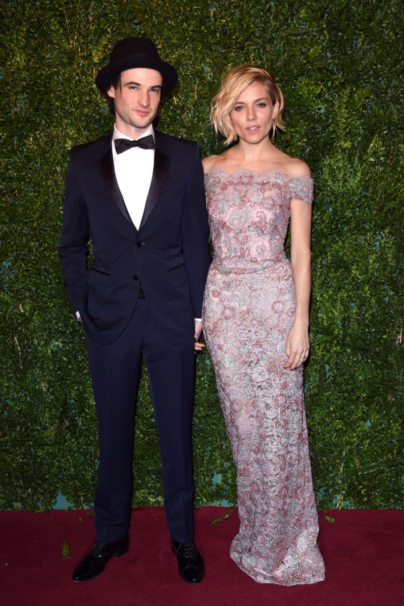 Tom Sturridge is as dapper as always, joining girlfriend Sienna Miller for a picture-perfect couple, dressed in Burberry.