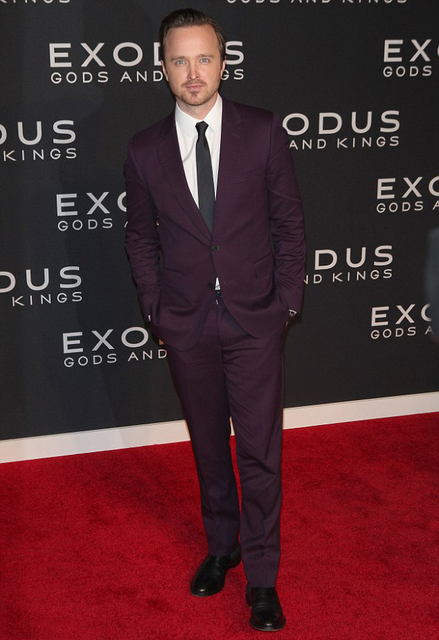 Hitting the red carpet of the New York premiere of 'Exodus: Gods and Kings' on December 7th, actor Aaron Paul went for a bold color decision. Wearing a purple two-button suit from Mr. Start, Paul stood out from the crowd with a rich color choice.