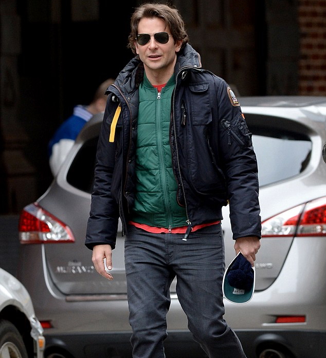 Bradley Cooper made a mad dash for the subway this past weekend as he rushed to a Sunday show of 'The Elephant Man'. With temperatures in New York City dropping, Cooper kept warm in a Parajumpers GOBI bomber jacket. For extra warmth, the 39 year-old actor layered with a bright green down jacket.