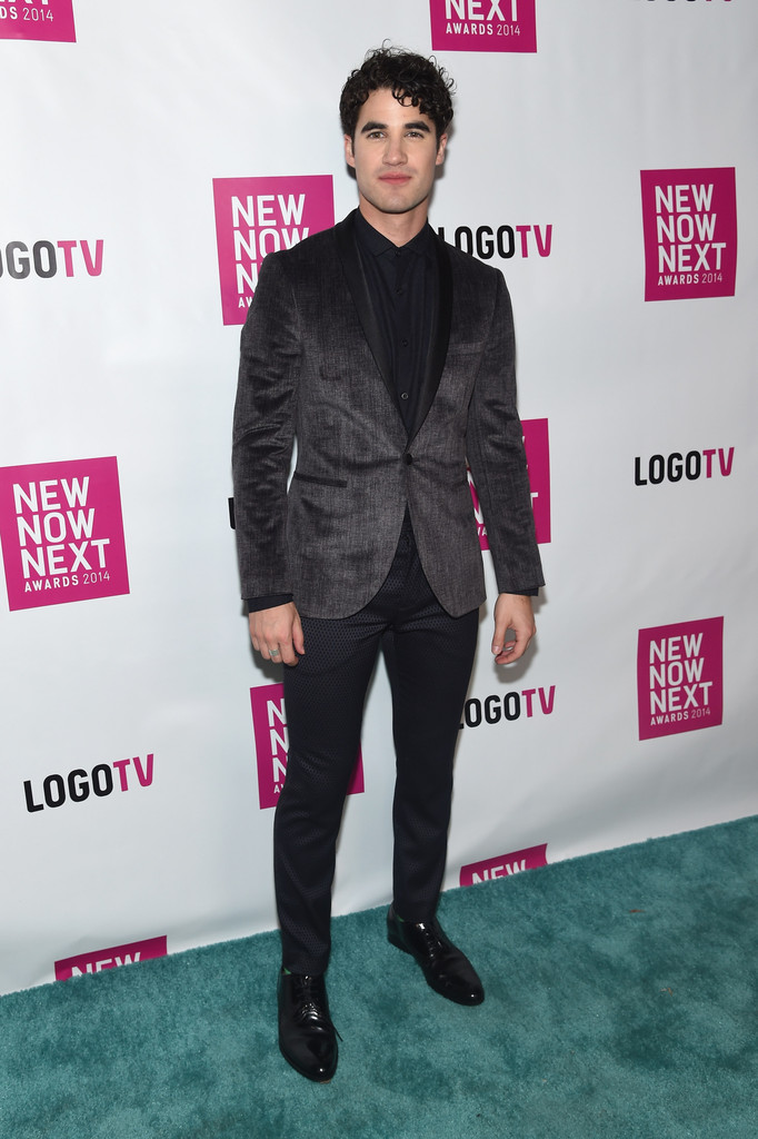 Attending Logo TV's 2014 NewNowNext Awards on December 2nd in Miami Beach, Florida, 'Glee' actor Darren Criss brought slim-cut glamour to the arrival photos. Stopping to pose for photos, Criss wore Topman's gray printed skinny fit velvet jacket with navy jacquard skinny dress pants.