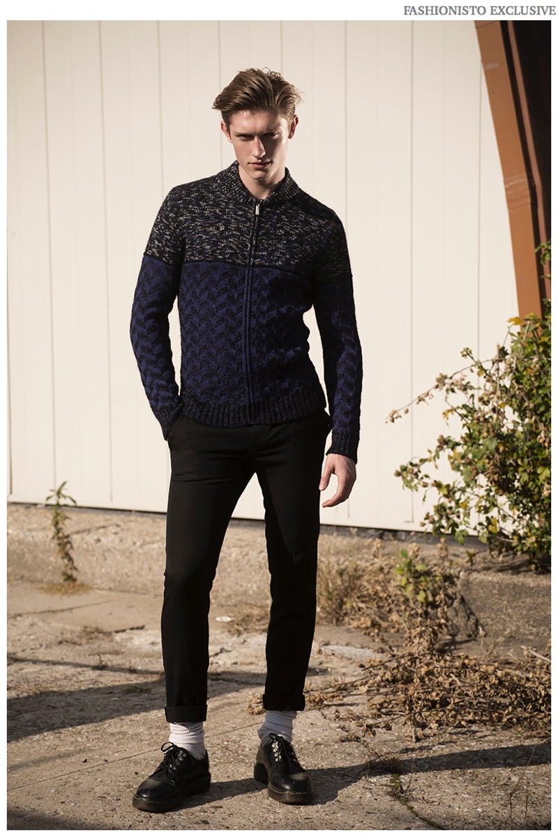 Callum wears sweater Just Cavalli, trousers Kenneth Ning, socks model's own and shoes Dr Martens.