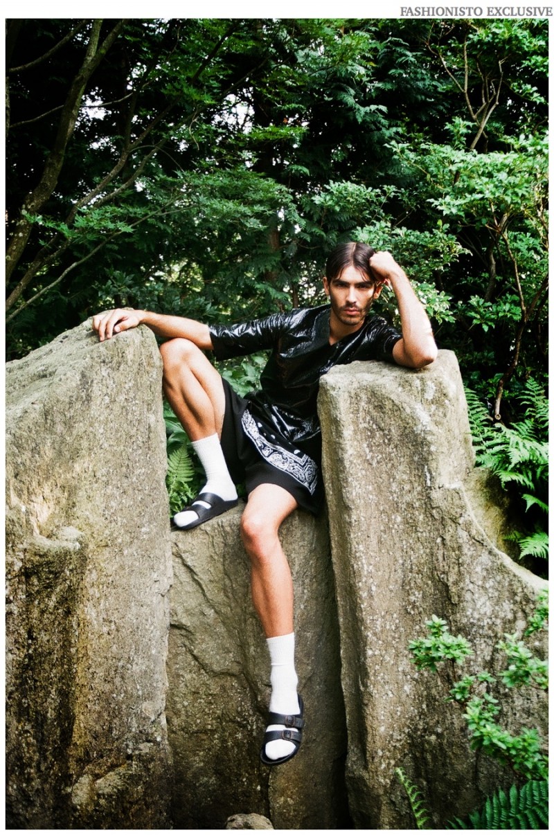 Daniel wears t-shirt Kevin Meunier, bandana t-shirt Desist, shorts KTZ, socks and sandals stylist's own.