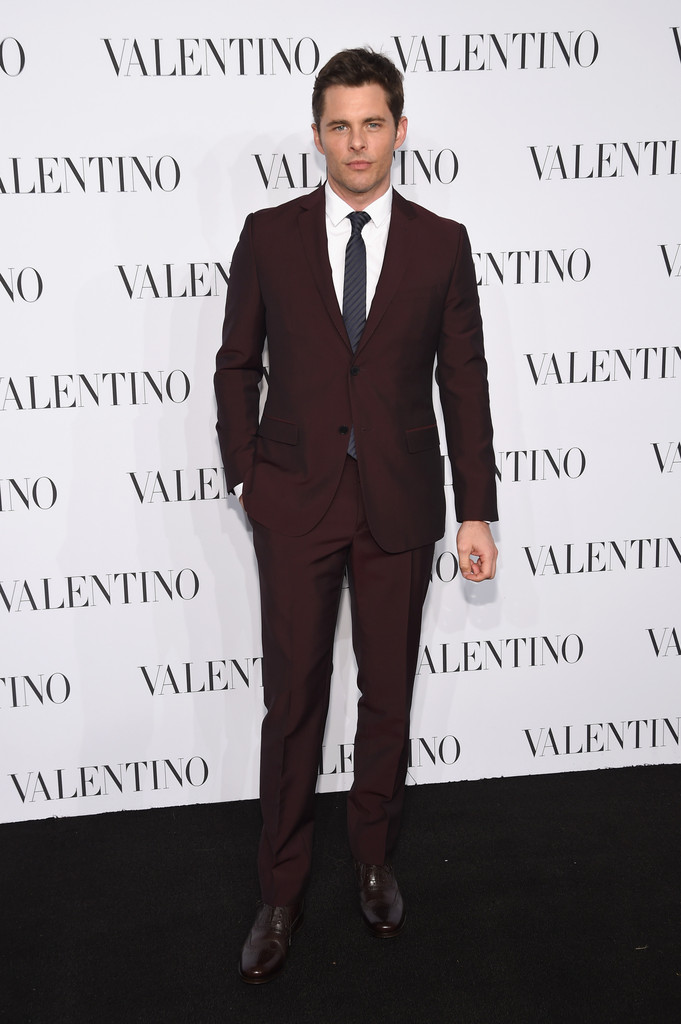 Always a sight to behold on the red carpet, actor James Marsden did not disappoint at the Valentino Sala Bianca 945 event on December 10th in New York City. Posing for photos, Marsden kept it chic in a deep burgundy, slim-cut Valentino suit with a striped tie.