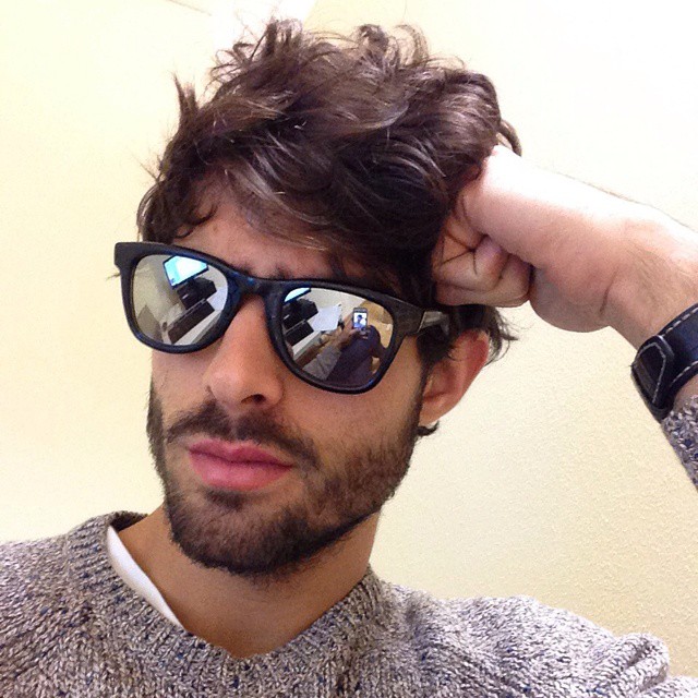 Juan Betancourt tries out some mirrored sunglasses