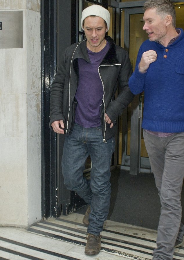 Spotted out and about London as he left BBC Radio 1 Studios, actor Jude Law kept his style casual with essential denim jeans, brown leather boots, a knit beanie and a relaxed t-shirt. Finishing his candid style, Law turned to Rick Owens with a modern leather shearling jacket.