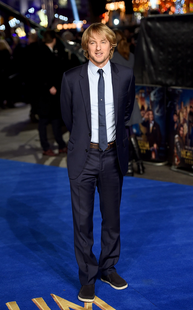 Touching down in London for the December 15th UK premiere of 'Night at the Museum: Secret of the Tomb', actor Owen Wilson hit the blue carpet in a look from Dior Homme. Wilson wore a navy pinstripe suit, paired with a skinny silk tie, dress shirt and a brown leather belt.