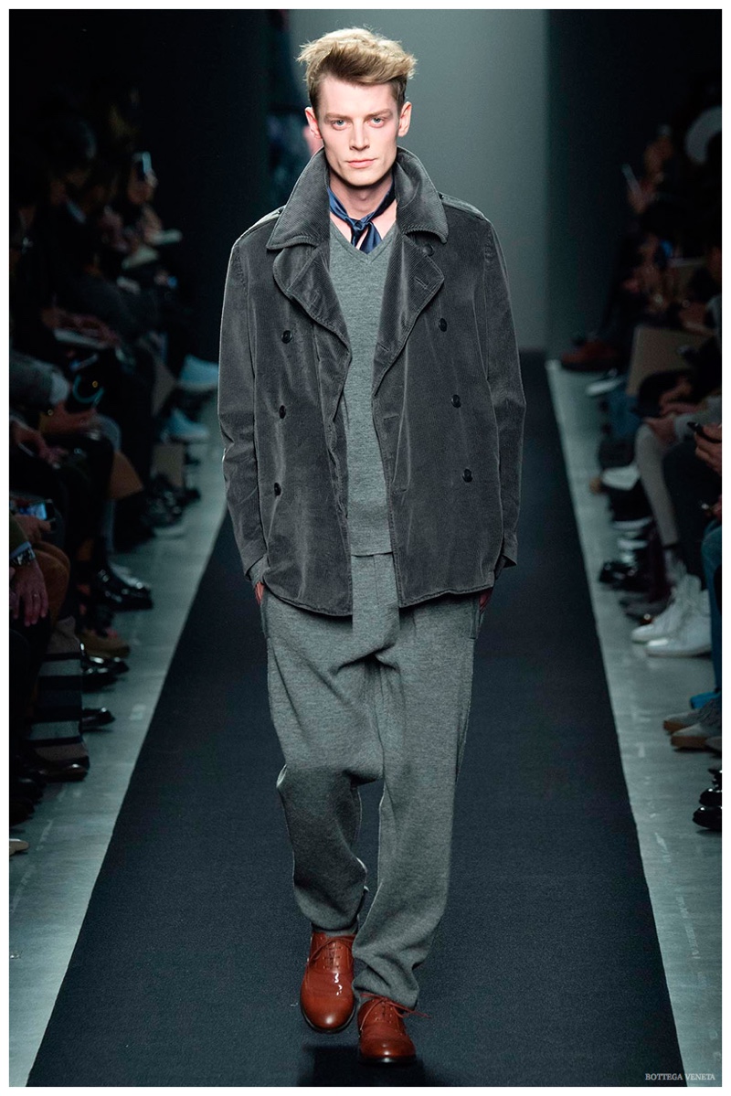 Bottega Veneta Fall-Winter 2015 Menswear Collection. Taking a relaxed approach to the season, Bottega Veneta creative director Tomas Maier delivered a cheeky collection with loose, slouchy proportions. Inspired by the idea of sweatpants and leisurewear, among the affair was a rich, double-breasted, gray corduroy jacket.