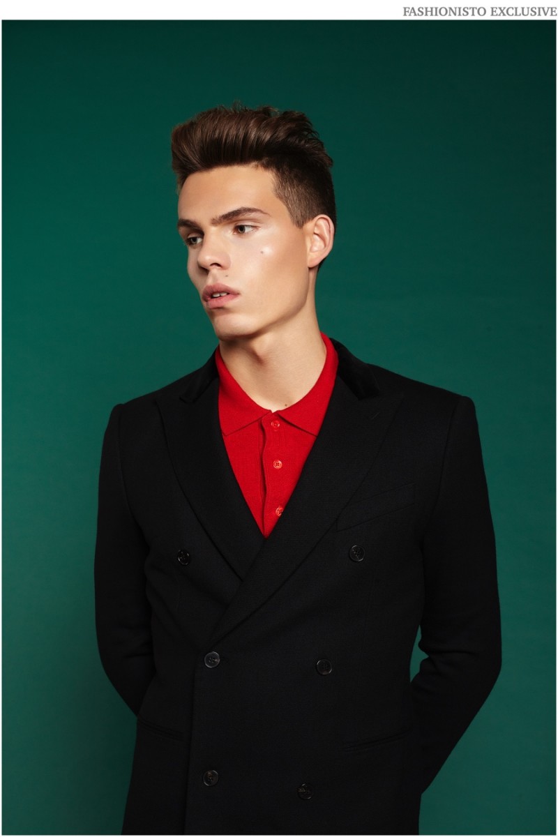 Orri wears blazer McQ by Alexander McQueen and polo shirt Fred Perry x Raf Simons.