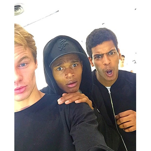 Select models James Chapman, O'Shea Robertson and Tidiou M'Baye pose for a silly image