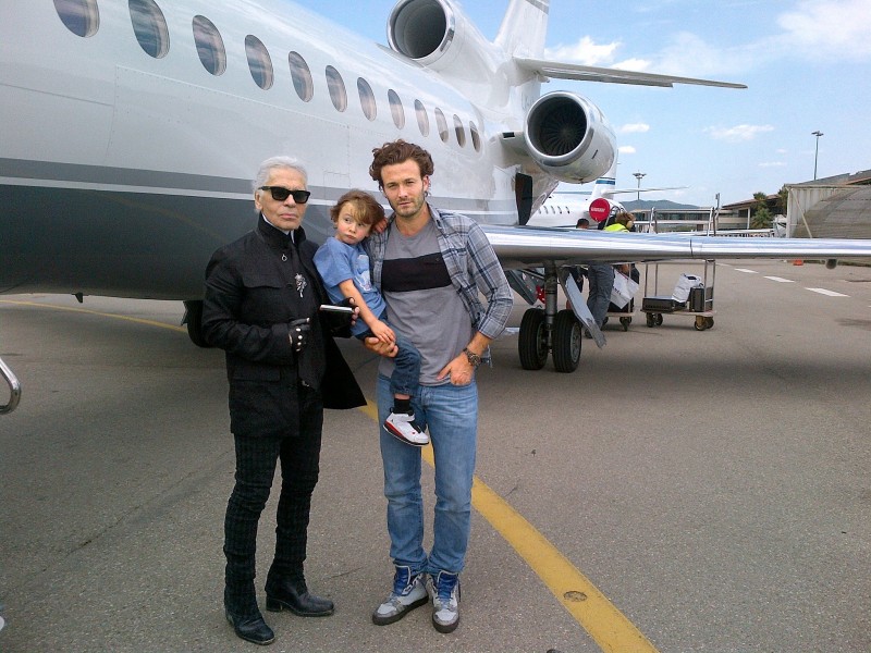 Karl Lagerfeld, Brad Kroenig and Hudson at an airport in the South of France in May 2013
