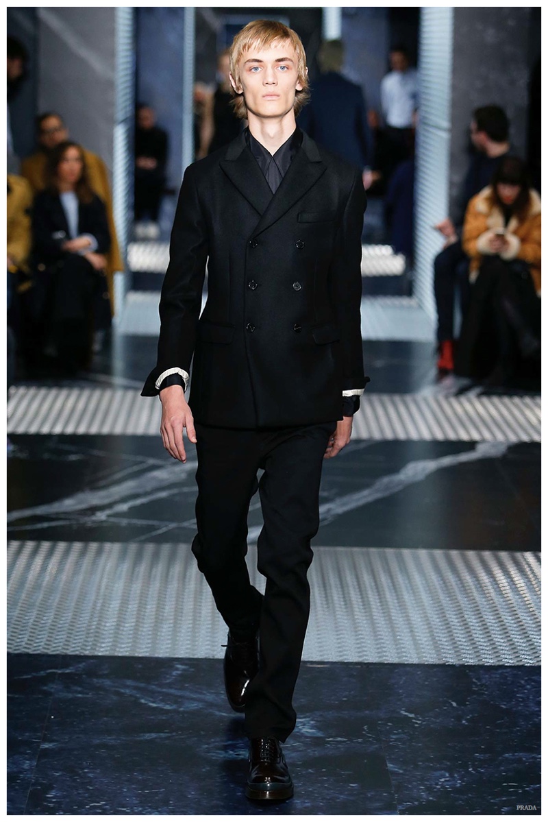 Prada Fall-Winter 2015 Menswear Collection. Designer Miuccia Prada had thoughts of simplicity on the mind for fall. A clean, minimal black color palette dressed sharp tailoring, lending itself nicely to the modern, lean suit.