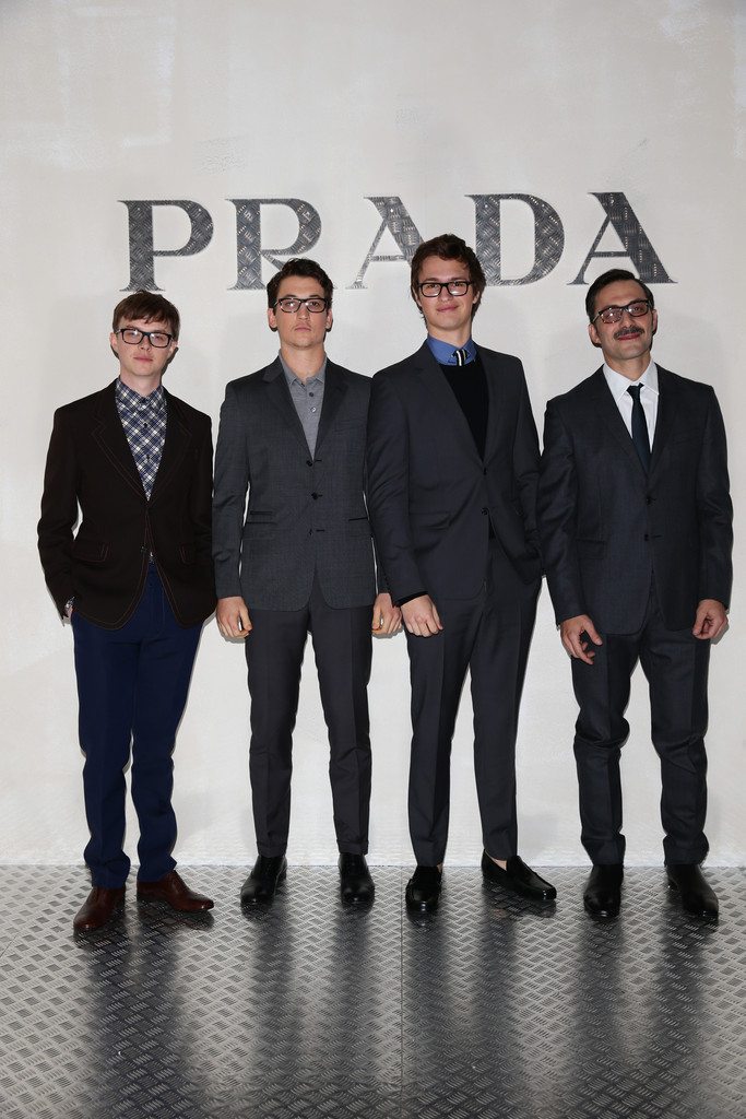 Donning tailored Prada suits, Dane DeHaan, Miles Teller, Ansel Elgort and Filippo Timi pose for a photo at Prada's Journal event on January 19, 2015. 