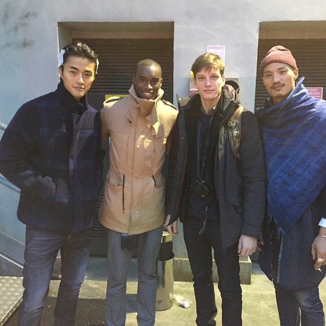 Zhao Lei, Corey Baptiste, Florian Van Bael and Paolo Roldan pose for an image at Giorgio Armani's show