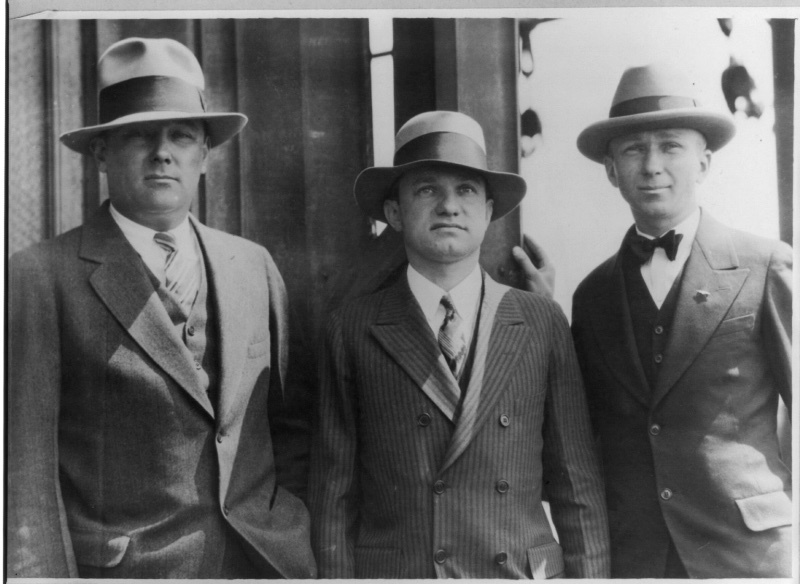Sporting tailored suits and snazzy fedora hats, Lloyd Bertaud, Charles Levine, and Clarence Chamberlin photographed in 1927. 