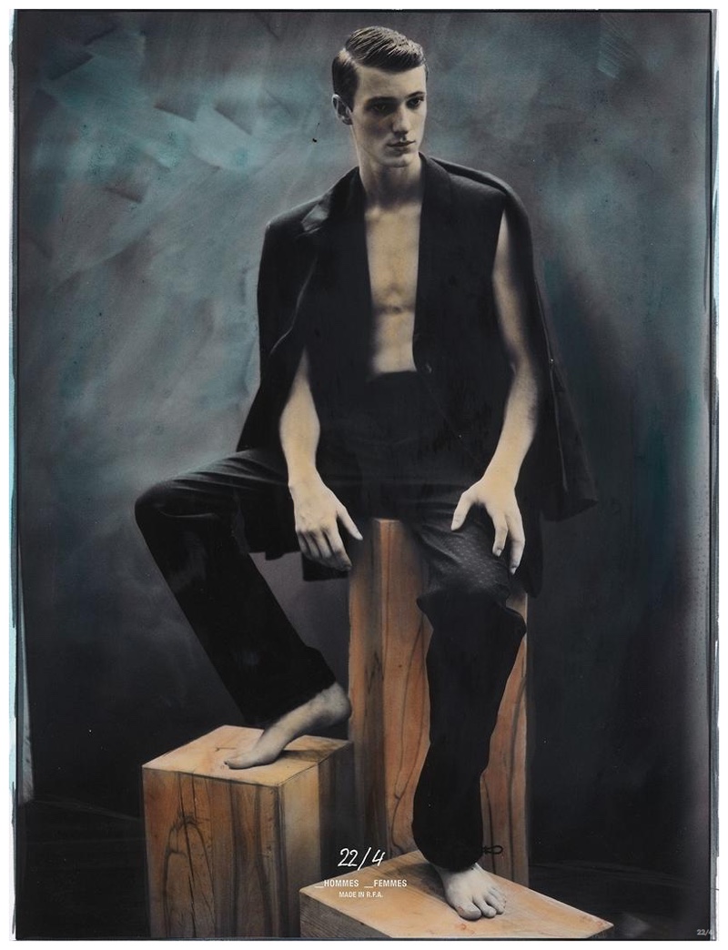 Sitting for a strong portrait, Tommaso de Benedictis imitates a cape look with a vest and jacket worn over the shoulders. 