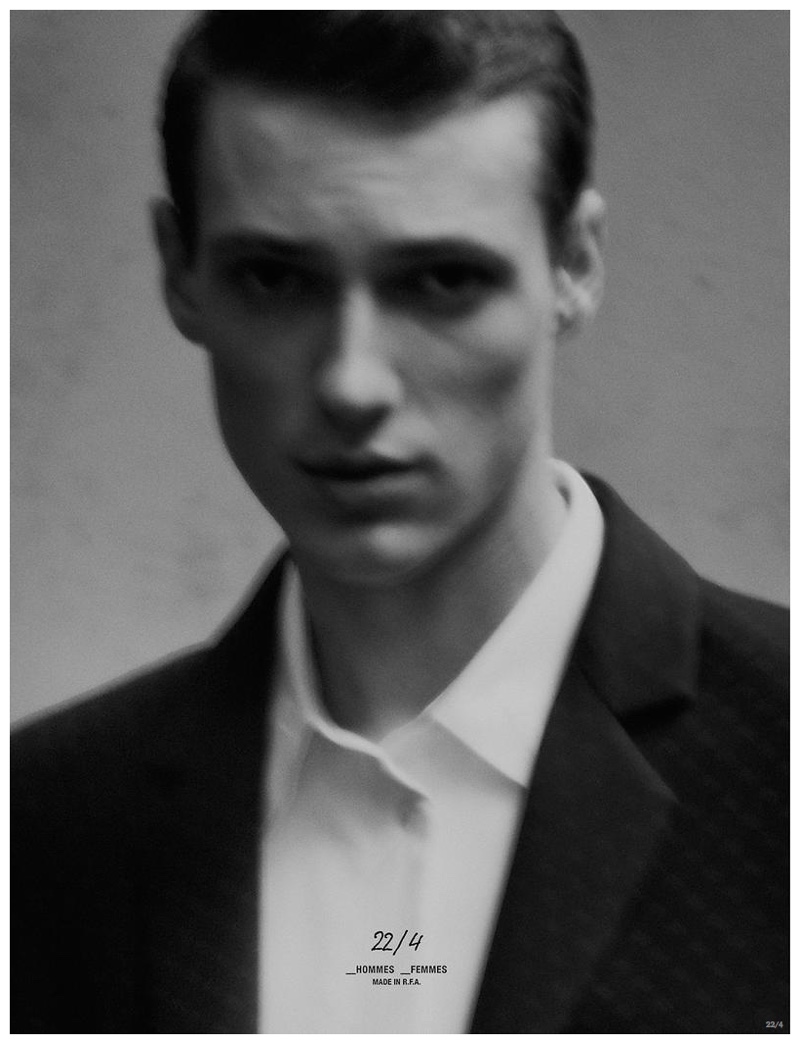 Tommaso de Benedictis poses for a close-up as he models a white dress shirt and black suit jacket.