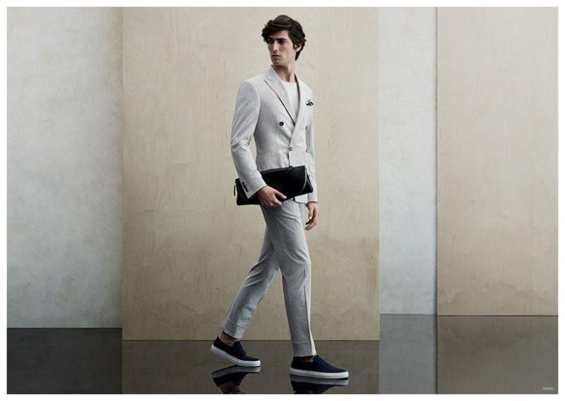 Tee x Sneakers: Canali knows a thing or two about the sneaker suit trend. Model Staffan Lindstrom wears a double-breasted suiting number with slip-on sneakers for the label's spring-summer 2015 advertising campaign. Here, the casualness of the sneakers are played off against the contrast of an impeccably tailored suit and the simplicity of a t-shirt.