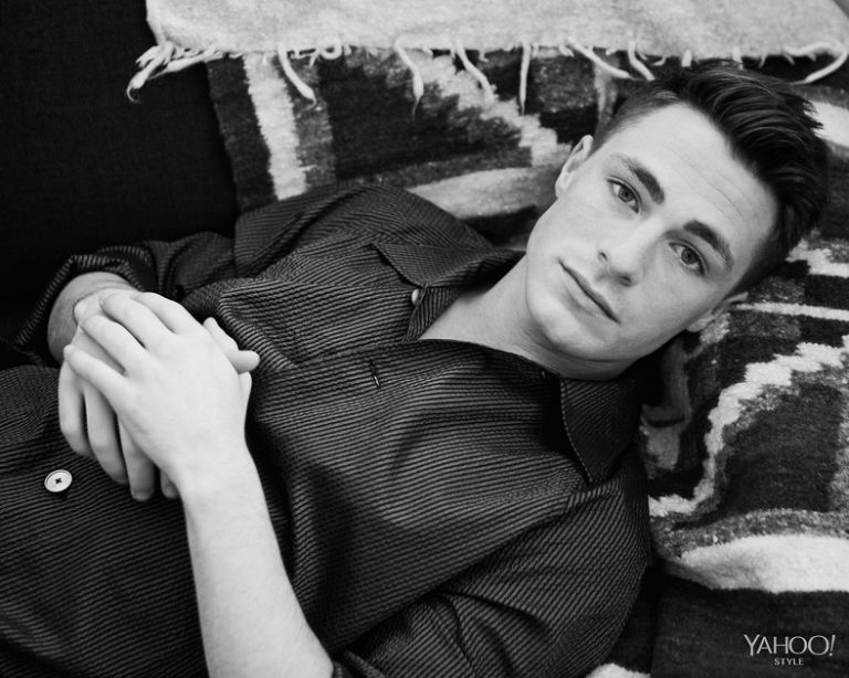 Posing for a black & white shot, Colton Haynes wears a striped Louis Vuitton shirt.