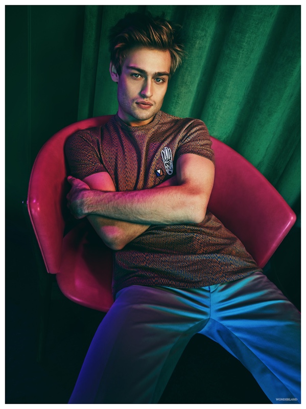 Douglas Booth goes modern in a top from Louis Vuitton and Fendi trousers.