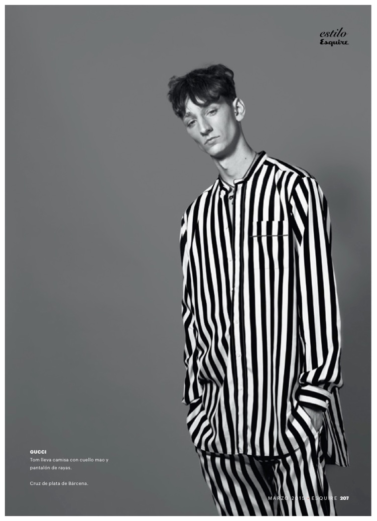 A prisoner to fashion, Tom Gaskin wears a striped Gucci outfit.