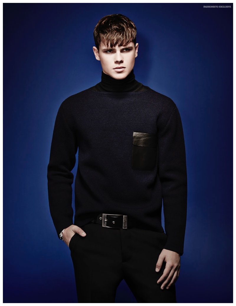 Casey wears sweater Gucci, turtleneck Hugo Boss, pants Dsquared2 and belt J.Lindeberg.