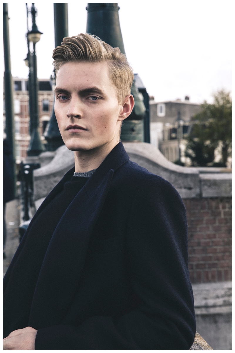 Jelmer wears sweater Hommard, coat Atelier Scotch and jeans Element.