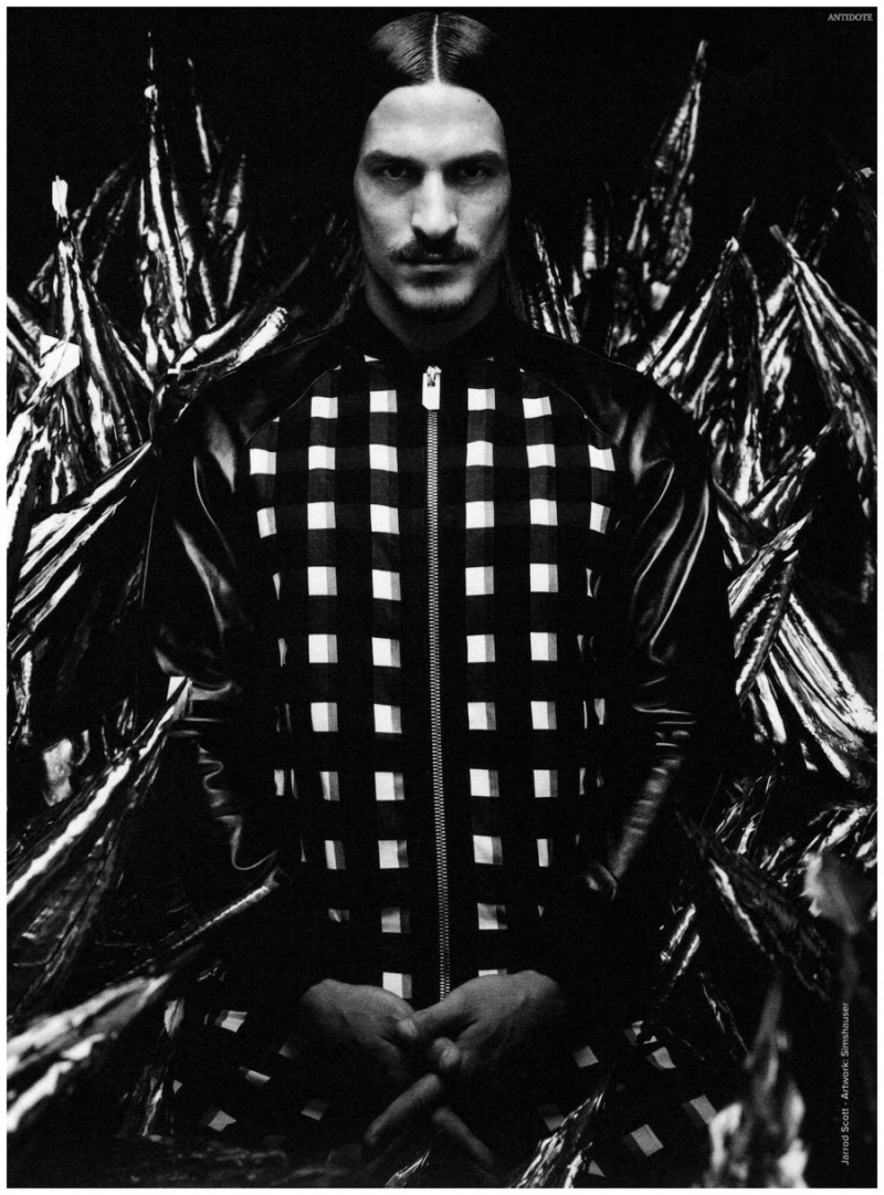 Jarrod Scott has a graphic moment in a black and white bomber jacket with leather sleeves.