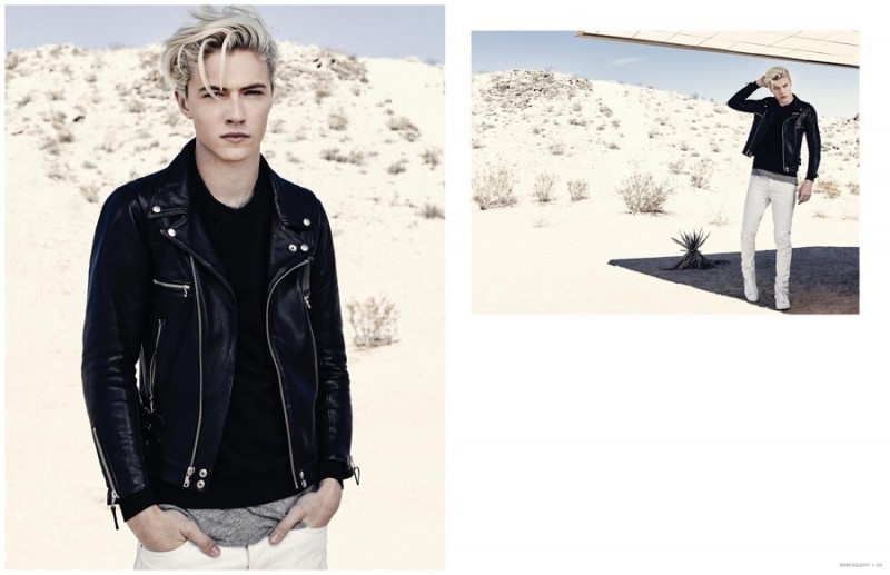 Lucky Blue Smith models a trendy black leather biker jacket with layered t-shirts and white denim jeans.