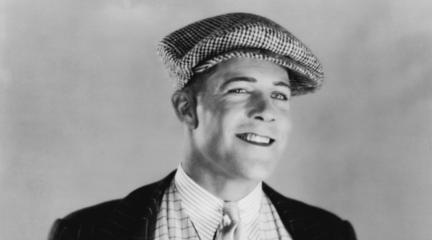 1920s Men's Fashions: Formal Trends Featuring Suits, Dress Shirts & Accessories Man wears a stylish vest along with a newsboy hat. Photo: everett225 / Deposit Photos