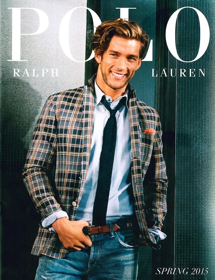 Photographed for Polo Ralph Lauren, model James Norley is all smiles in a plaid unstructured blazer, paired with a light blue oxford shirt, brown leather tie, navy knit tie and distressed denim jeans.