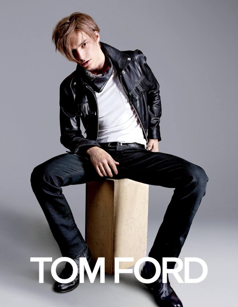 Timothee Bertoni sits for a simple campaign image featuring Tom Ford's denim jeans.