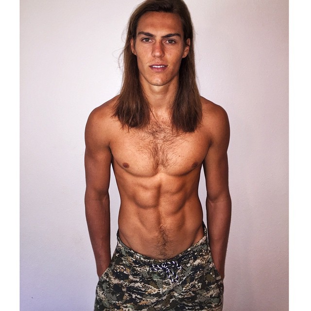 Travis Smith poses for a new polaroid