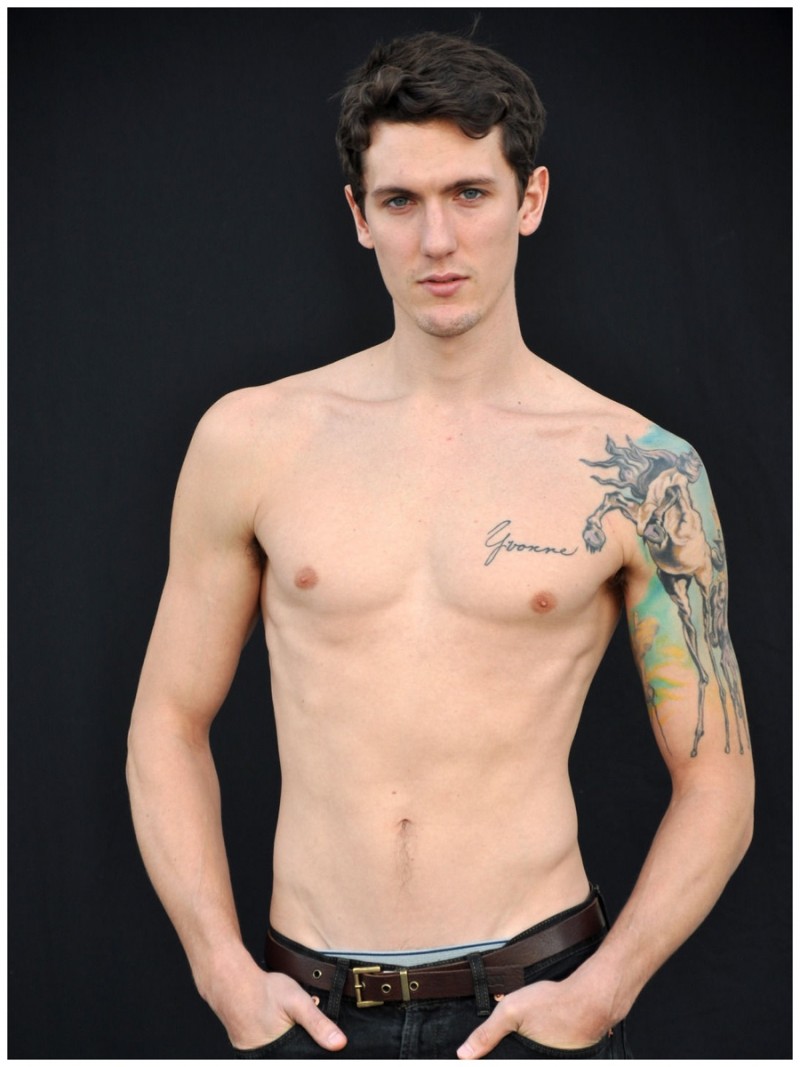 Tyler Riggs goes shirtless unveiling his tattoos for a digital photo update.