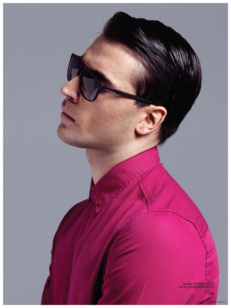 Ali Tank is cool in a pair of black shades, matched with a hot magenta shirt.