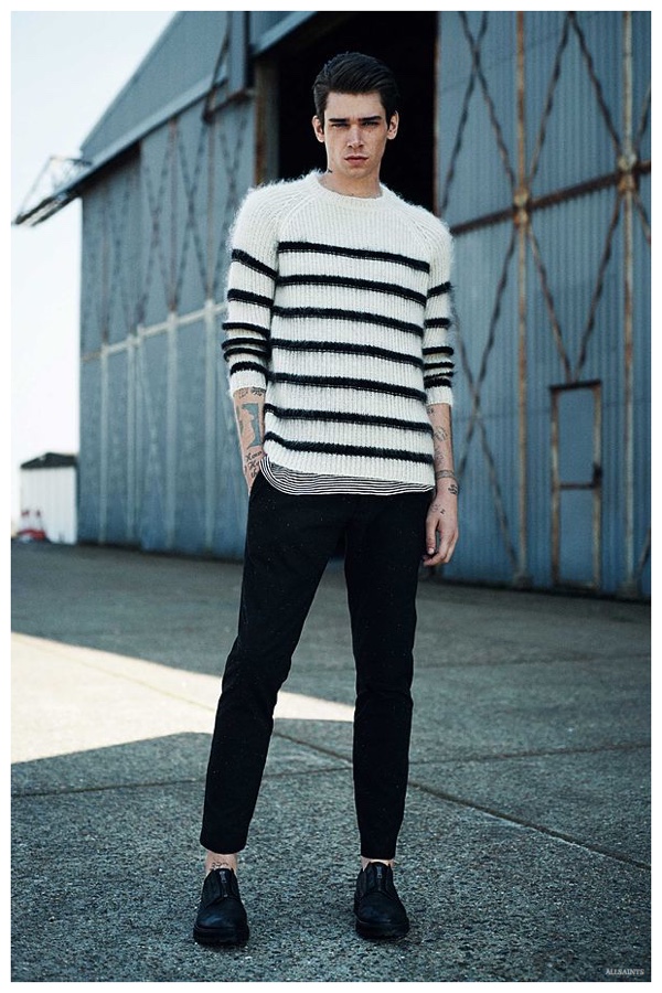 Reuniting with AllSaints, American model Cole Mohr sports a white and black striped knit with lean pants.