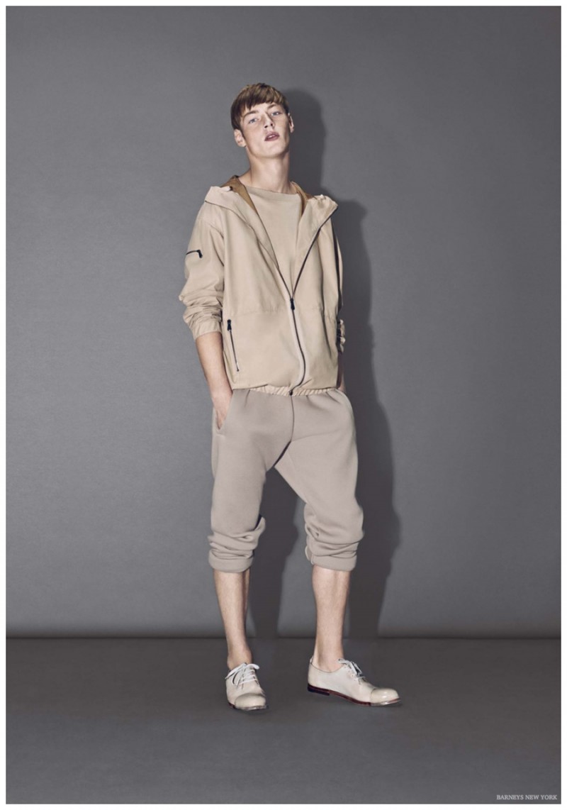 Roberto Sipos models neutral, sporty look from Bottega Veneta.