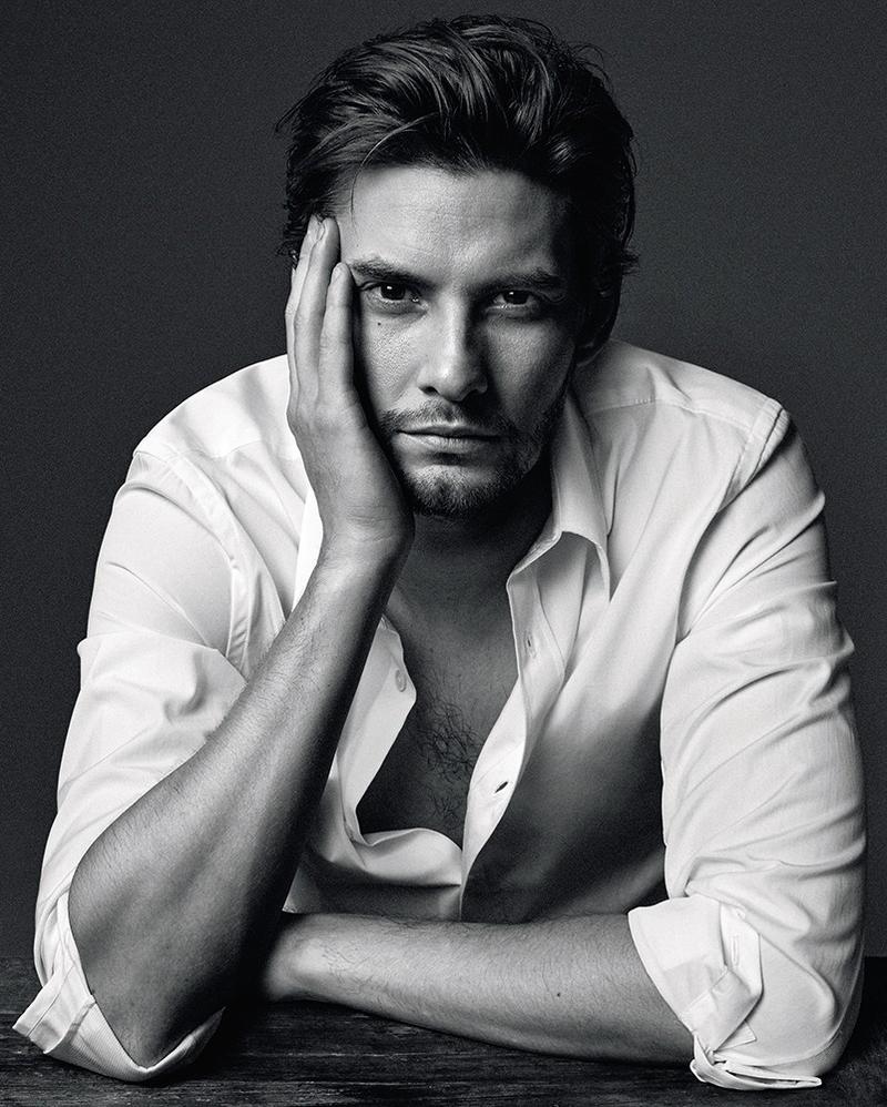 Ben Barnes poses for a photograph in a classic white dress shirt.