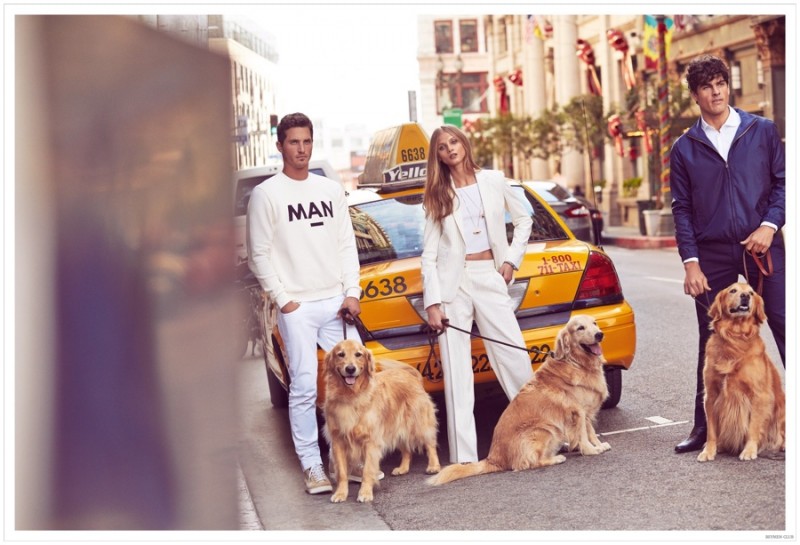 Ollie, Anna and Evandro pose with dogs.