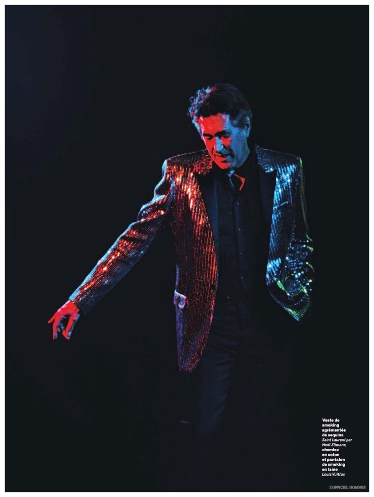 Embracing a glitzy look, Bryan Ferry wears a sequined Saint Laurent blazer.