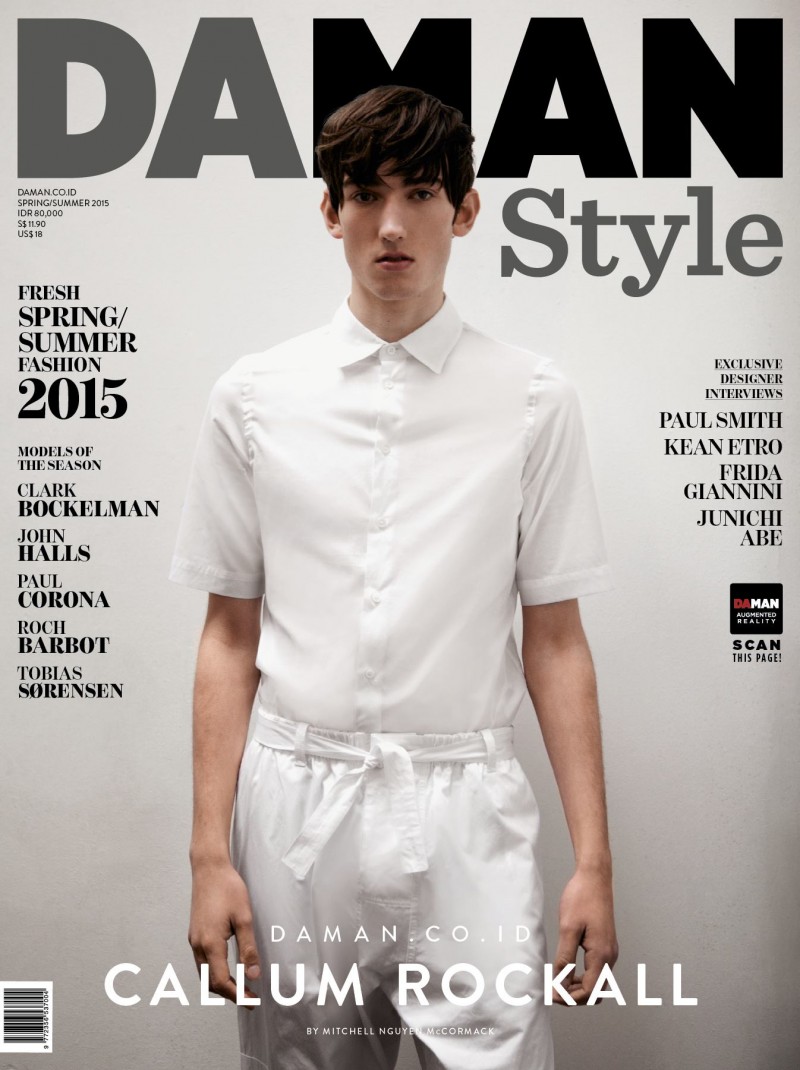 Dressed in a white spring look, model Callum Rockall is photographed by Mitchell Nguyen McCormack for the cover of Da Man Style.