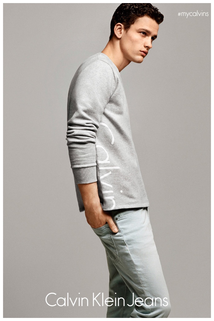 Simon Nessman sports a gray logo top from Calvin Klein Jeans.