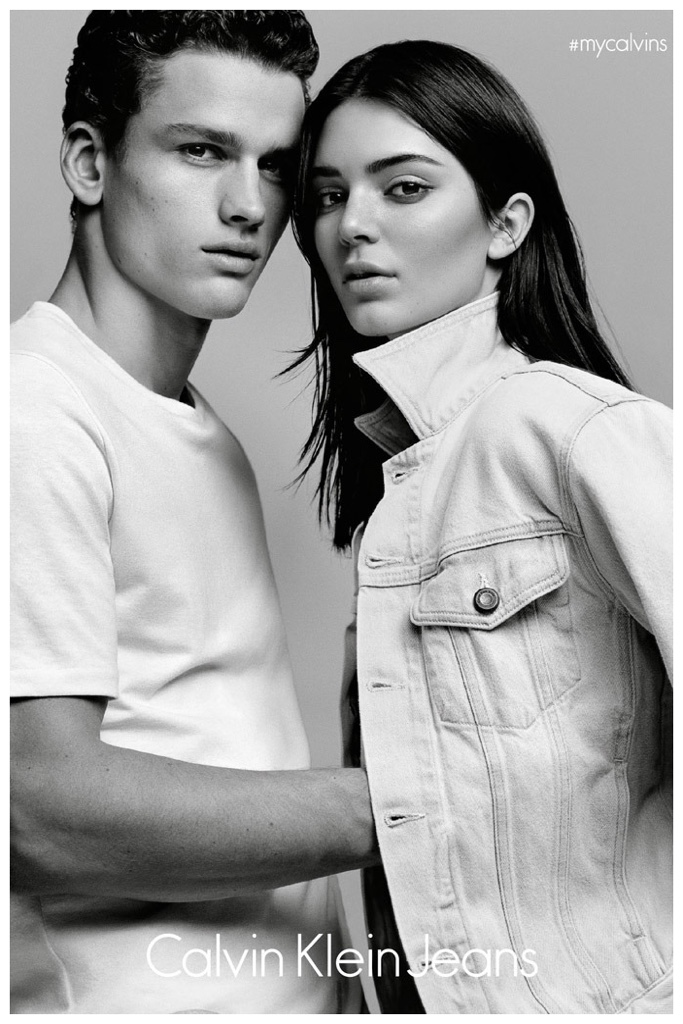 Modeling a white t-shirt, Simon Nessman joins Kendall Jenner for a photo.