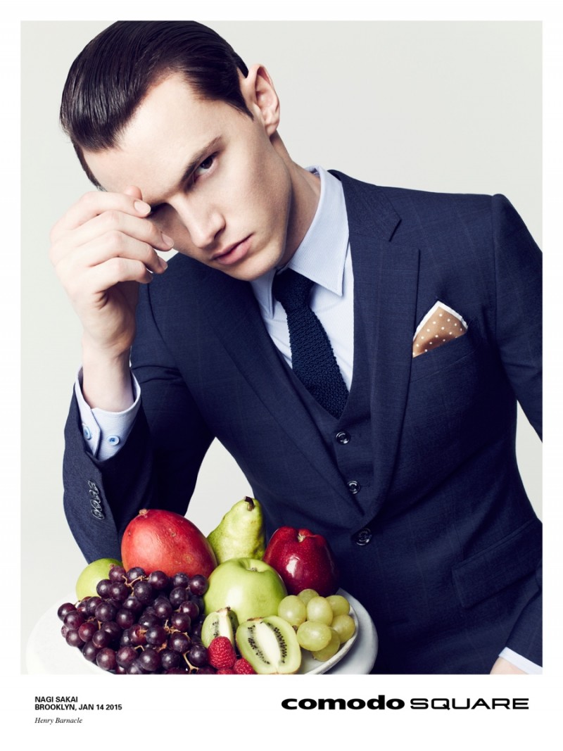 British model Henry Barnacle cleans up in a navy three-piece suit.